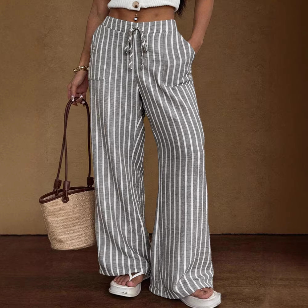 Women's striped wide-leg trousers with lace-up elastic waist and loose fit by Plush Fashion Hub, shown in the image.