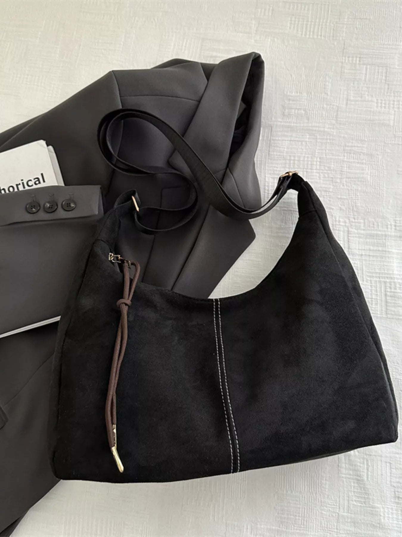 Simply Love adjustable strap crossbody bag with a sleek design, featuring a black exterior and a comfortable strap.