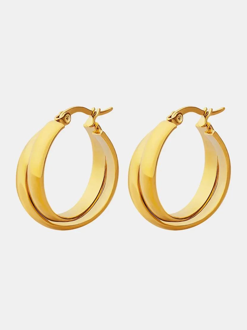 18K gold-plated titanium steel huggie earrings with a sleek, modern design, shown close-up on a white background.