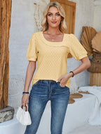 Eyelet asymmetrical neck short sleeve T-shirt from Plush Fashion Hub featuring a modern design and stylish details.
