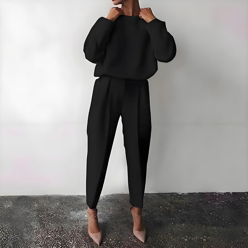 Women’s solid color 2-piece loungewear set by FitiqueFit featuring a long sleeve top and pleated pants, casual and comfortable.