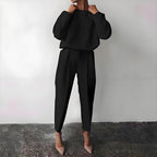Women’s solid color 2-piece loungewear set by FitiqueFit featuring a long sleeve top and pleated pants, casual and comfortable.
