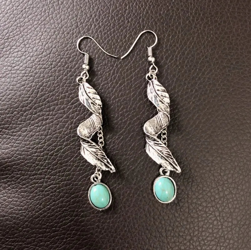 Turquoise alloy leaf earrings by Plush Fashion Hub featuring intricate leaf-shaped design and vibrant turquoise color.