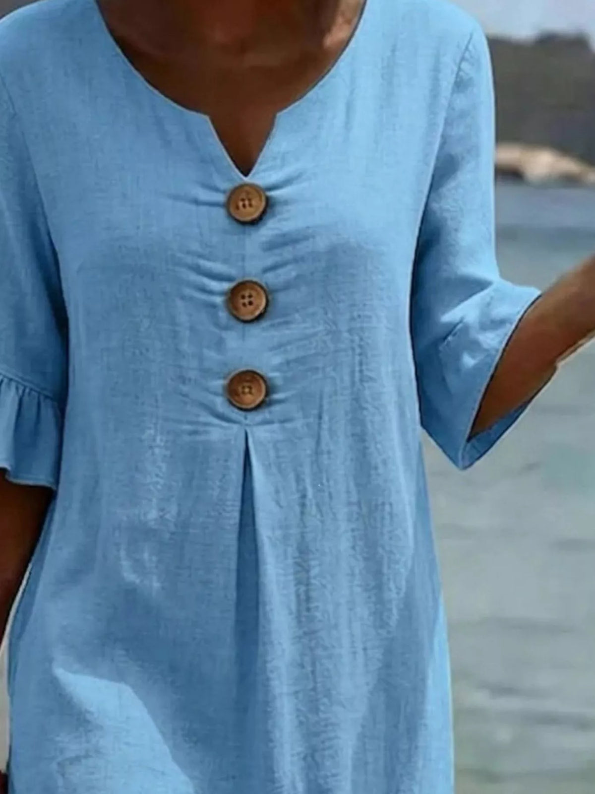 Plus size ruffle sleeve midi dress with button decor by Plush Fashion Hub, shown in a stylish, flowy design with ruffle details.