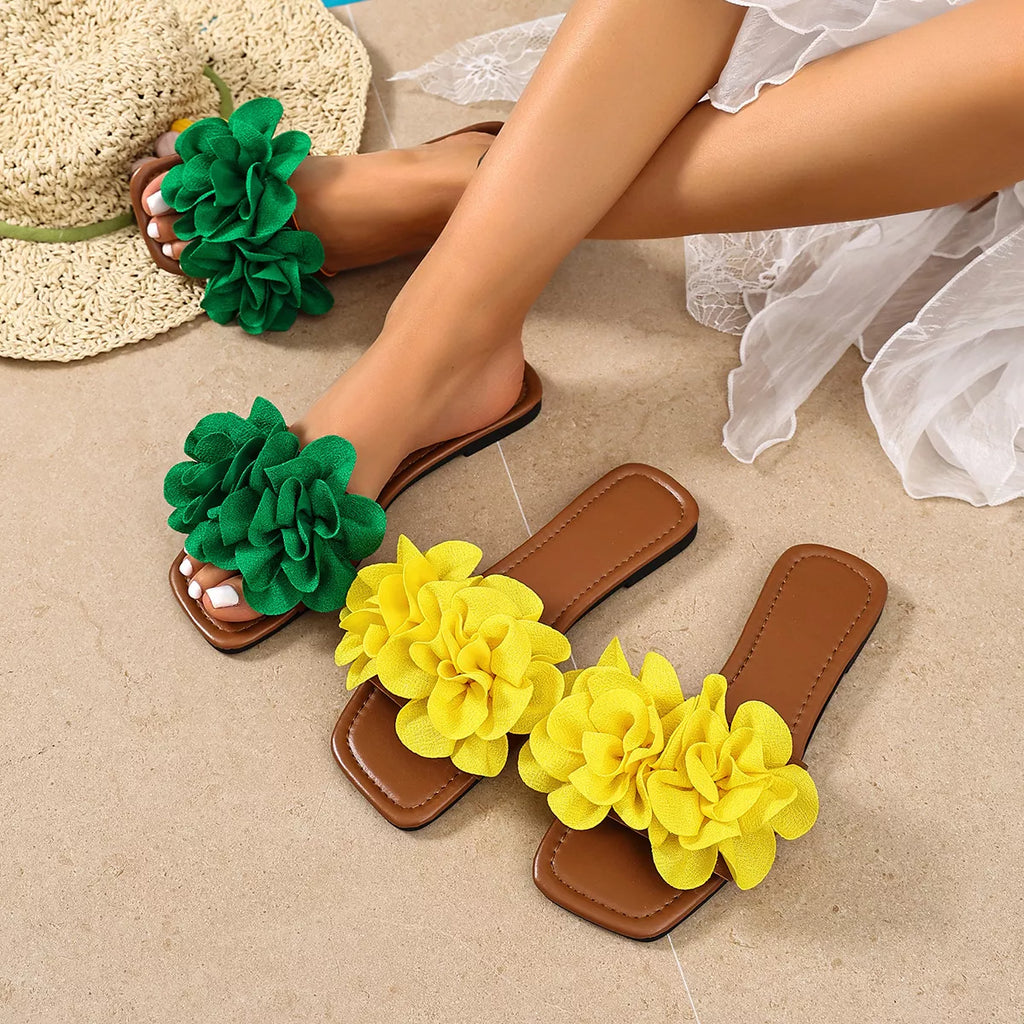 Floral-embellished flat sandals by Plush Fashion Hub featuring colorful floral details and comfortable flat design.