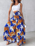 Printed wide-leg pants by Shopimist featuring a flowy design and vibrant pattern, shown on a model.