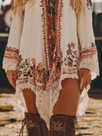 Elegant long sleeve lace trim mini dress by Trendsi, featuring romantic design, perfect for cocktail and daywear occasions.