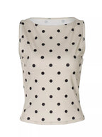 Polka dot tank top from Shopimist featuring a sleeveless design with a fitted silhouette and playful black and white dot pattern.