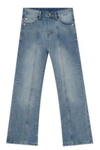 Raw hem denim jeans with front and back pockets from Trendsi, showcasing a casual, stylish look in a close-up shot.