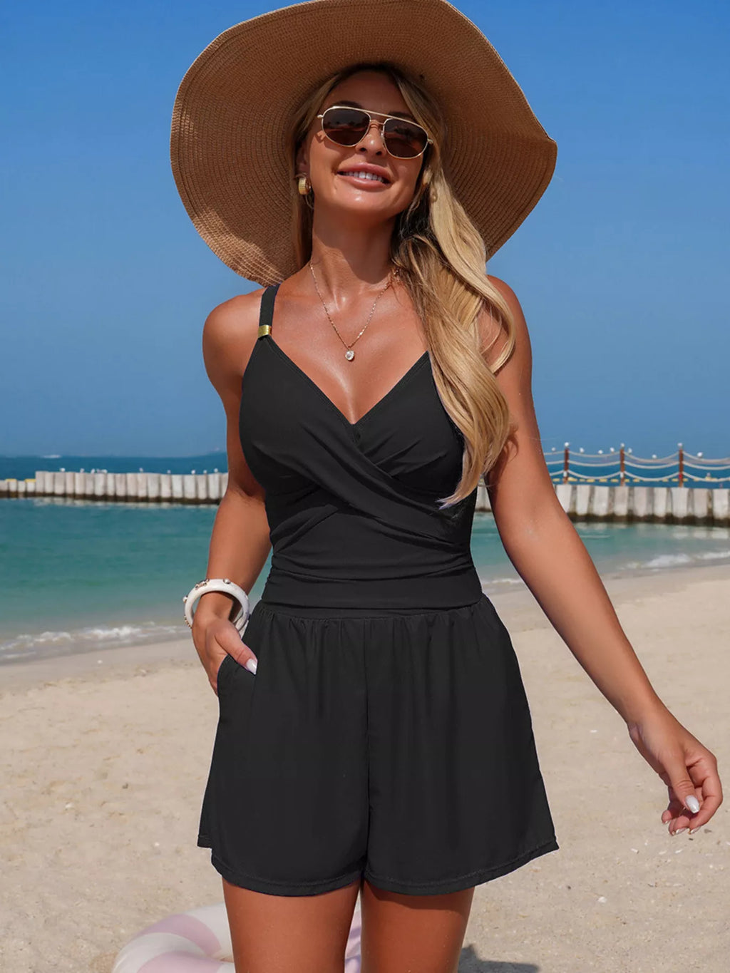 Women's V-neck spaghetti strap one-piece swimsuit by Trendsi, featuring stretchy beachwear fabric and a sleek, fitted design.