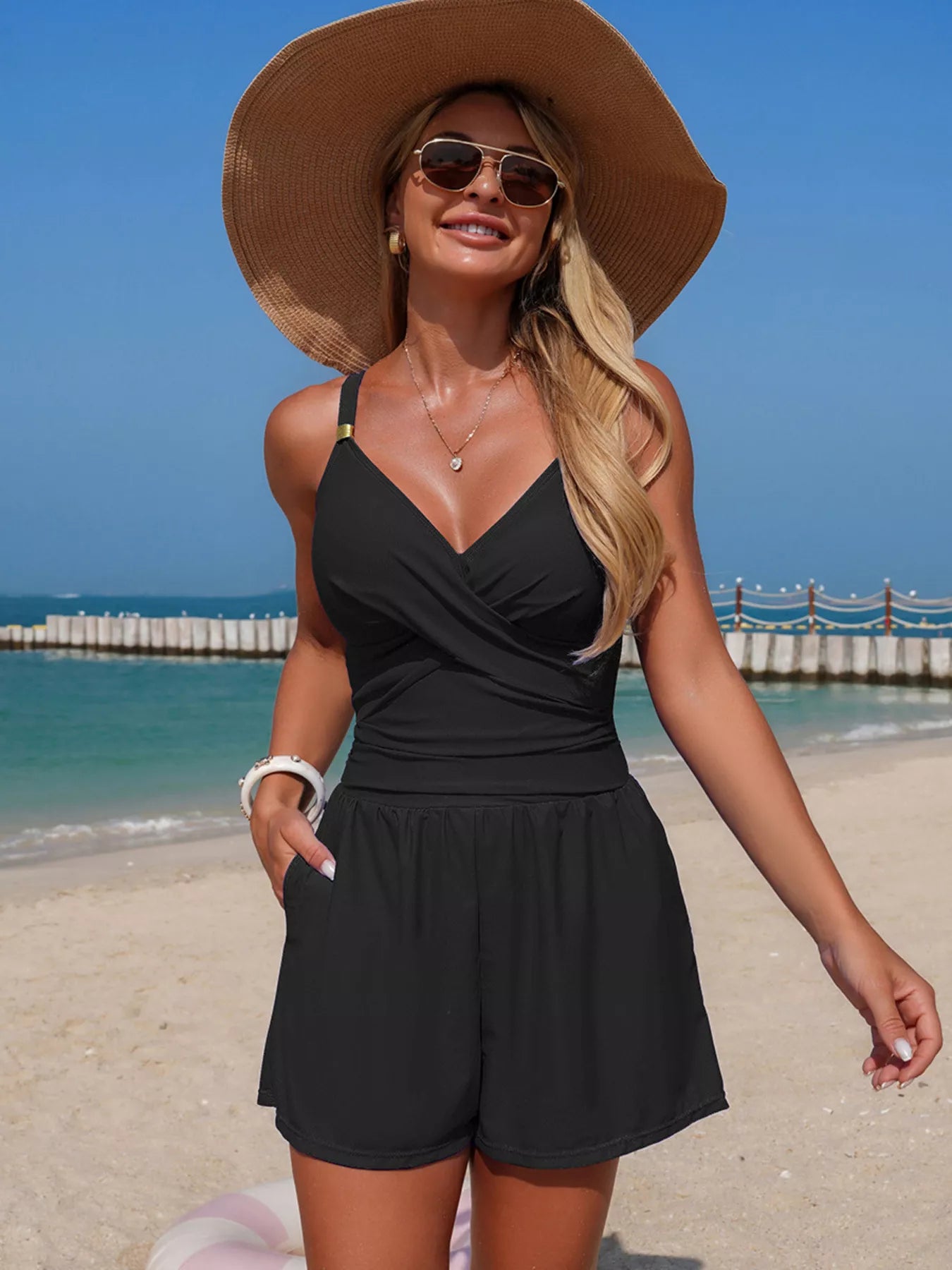 Women's V-neck spaghetti strap one-piece swimsuit by Trendsi, featuring stretchy beachwear fabric and a sleek, fitted design.
