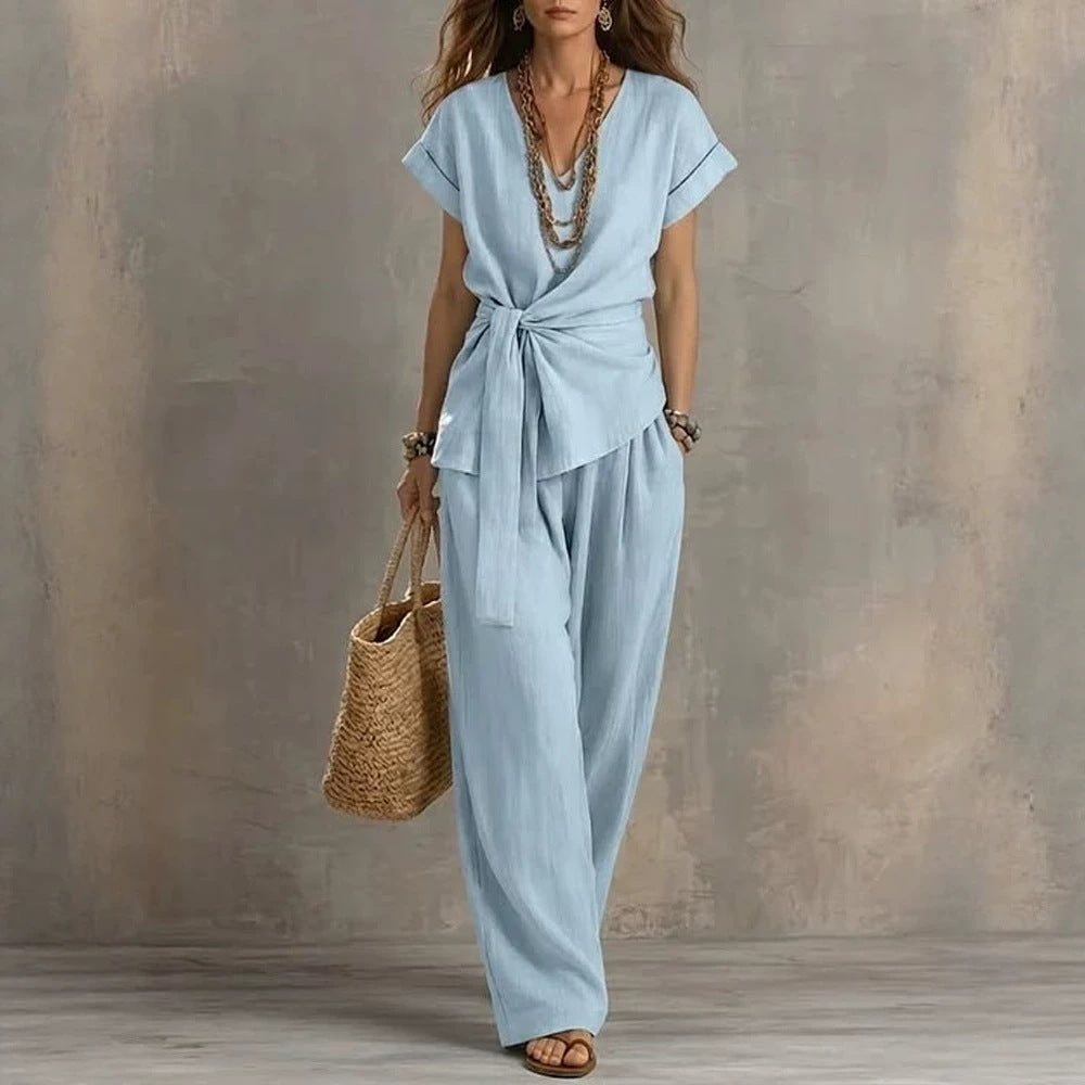 Women's V-neck short-sleeve top and pants two-piece set by Plush Fashion Hub, featuring a stylish, comfortable matching outfit.