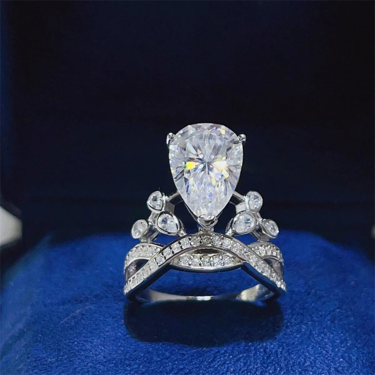 Sterling silver ring with a 5-carat moissanite gemstone, featuring a polished band and elegant design.