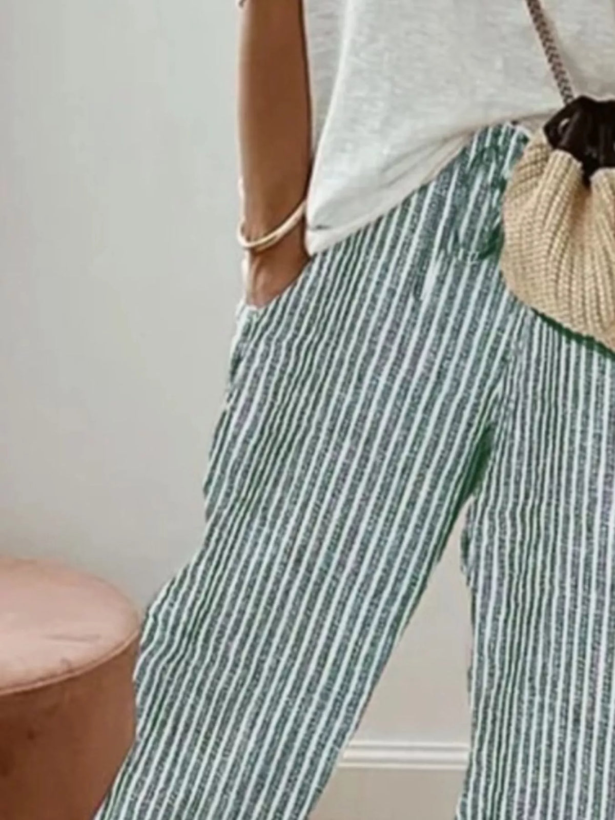 Striped cropped pants by Plush Fashion Hub featuring a stylish design, fitted waistband, and casual ankle-length cut.