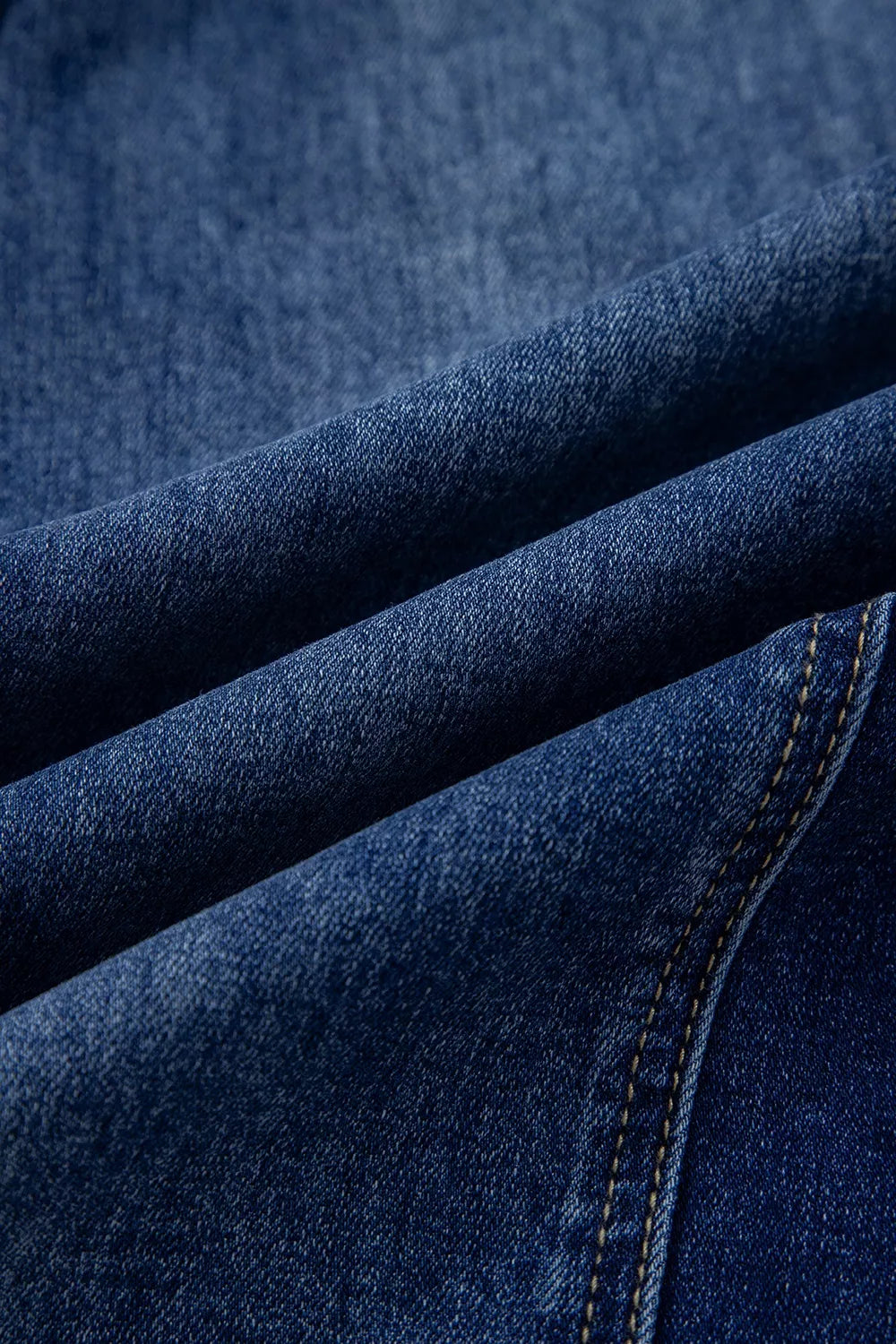 Wide-leg denim pants by Plush Fashion Hub featuring drawstrings, seam details, and raw hem, styled with a relaxed fit.