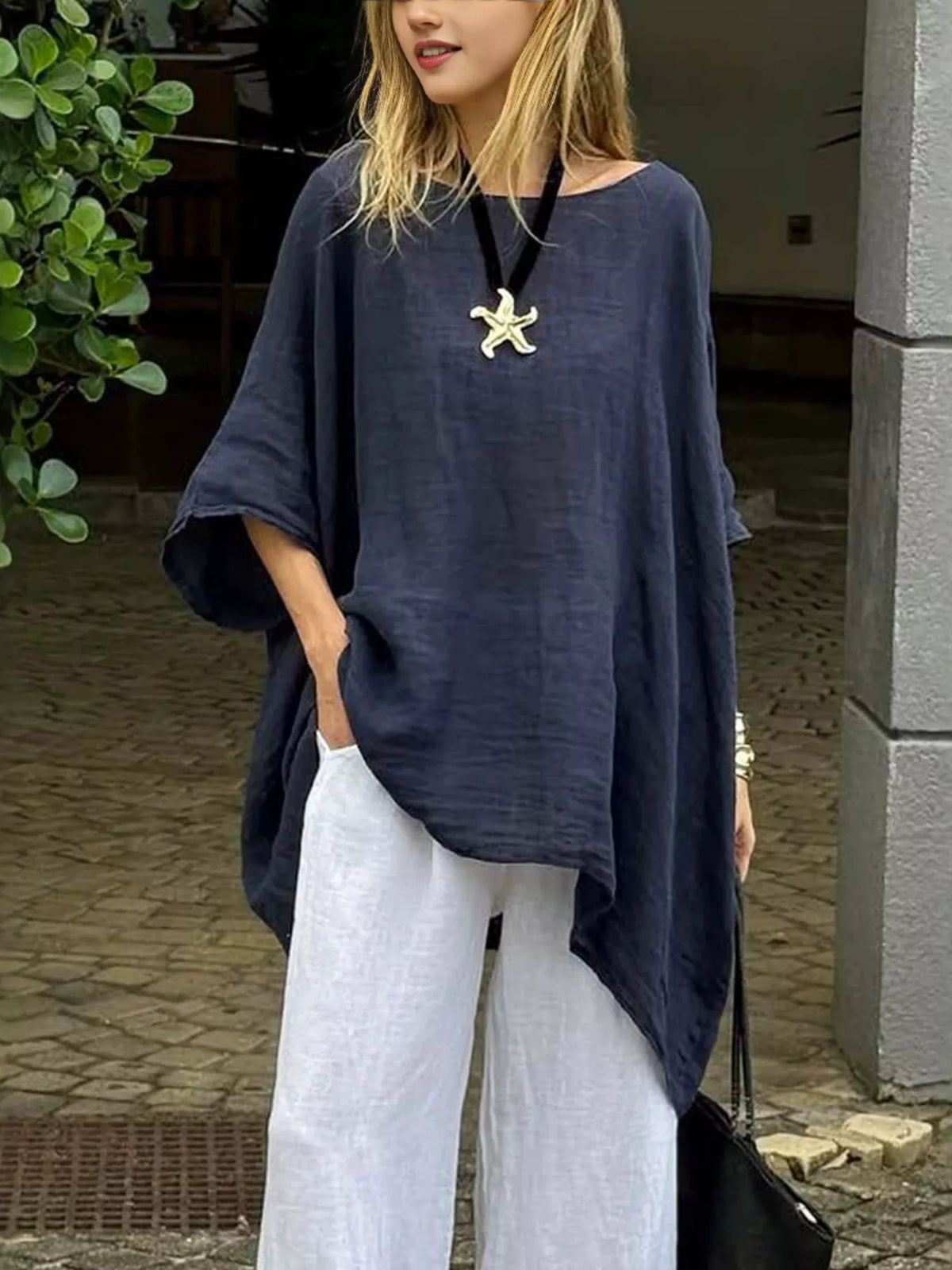 Plus size loose fit asymmetrical hem tunic top by Plush Fashion Hub, shown in a relaxed, flowing silhouette with a stylish asymmetrical hem.