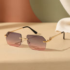 Gold frame cheetah rimless sunglasses showcasing a bold, hip-hop style design with dark lenses and sleek eyewear construction.