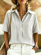 Women's striped short-sleeve shirt with turn-down collar from Plush Fashion Hub, shown hanging on a white background.