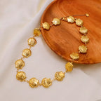 18K gold-plated shell necklace with delicate chain and seashell pendant, styled for a beach-inspired look.