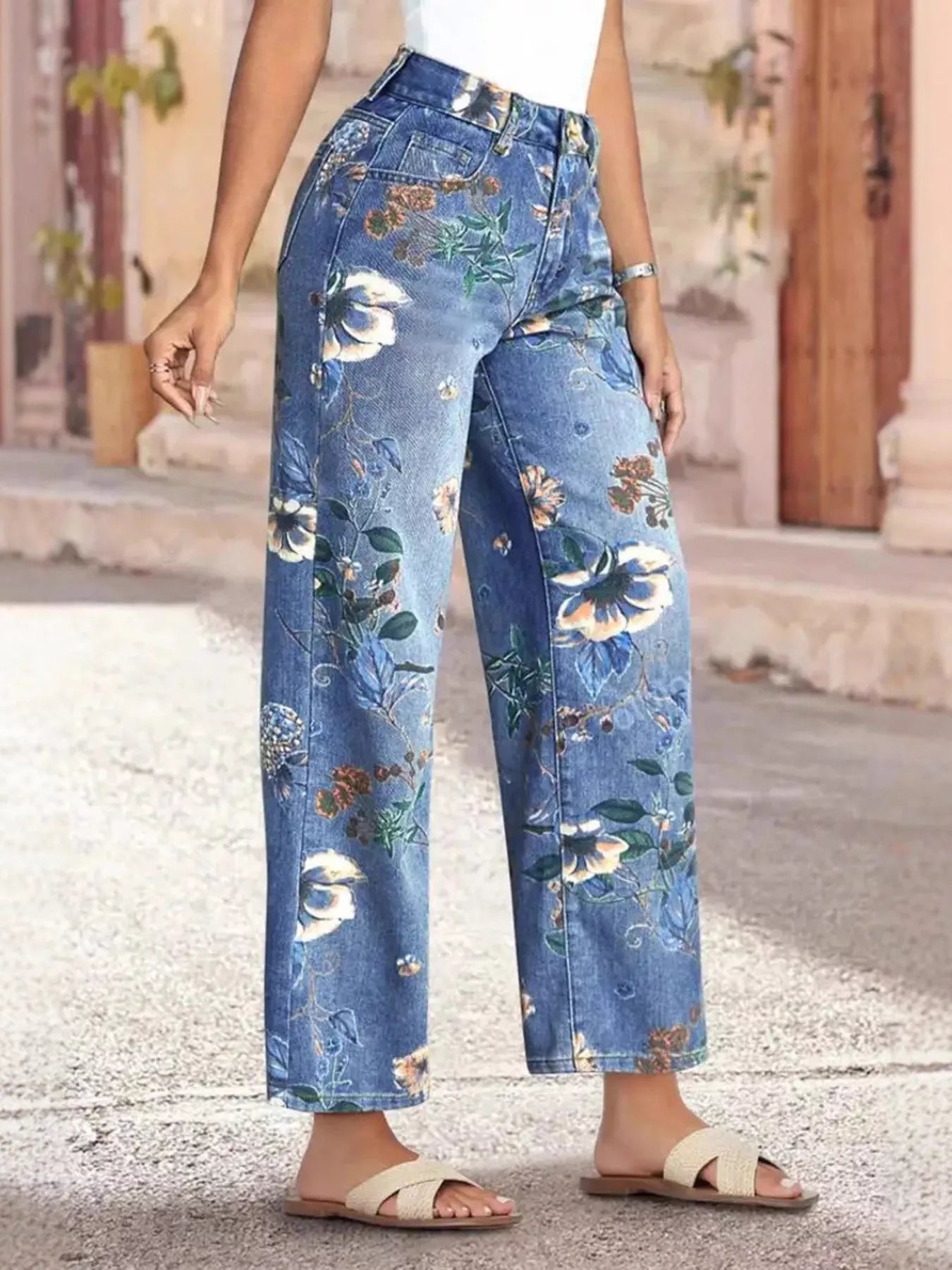 Floral print wide-leg jeans from Trendsi, showcasing a stylish bottom with vibrant floral patterns and relaxed fit.