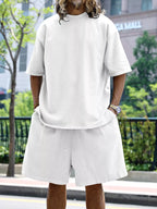 Men's relaxed fit T-shirt and shorts set in plus size from Trendsi, casual tops with comfortable, loose-fitting design.