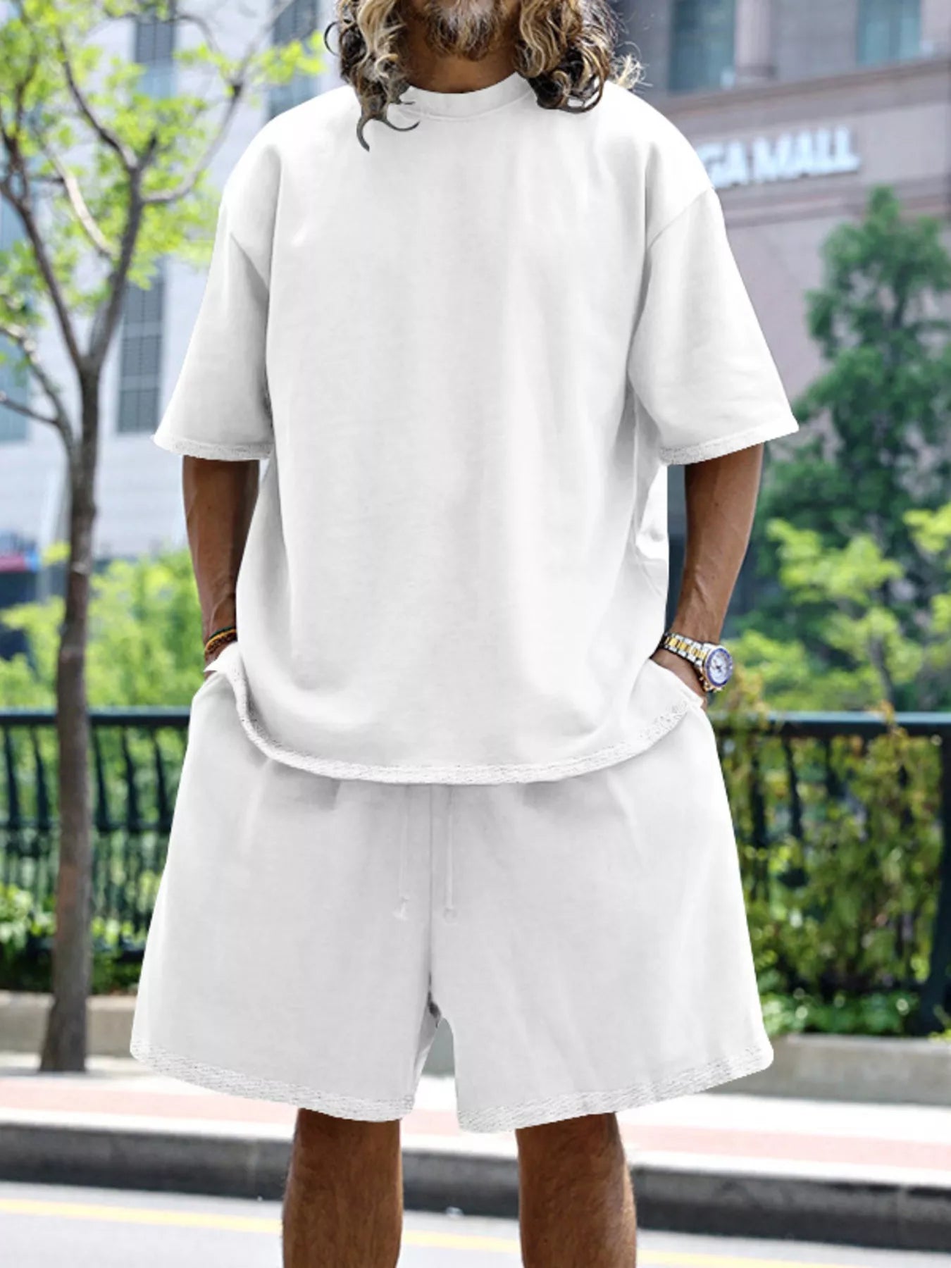 Men's relaxed fit T-shirt and shorts set in plus size from Trendsi, casual tops with comfortable, loose-fitting design.