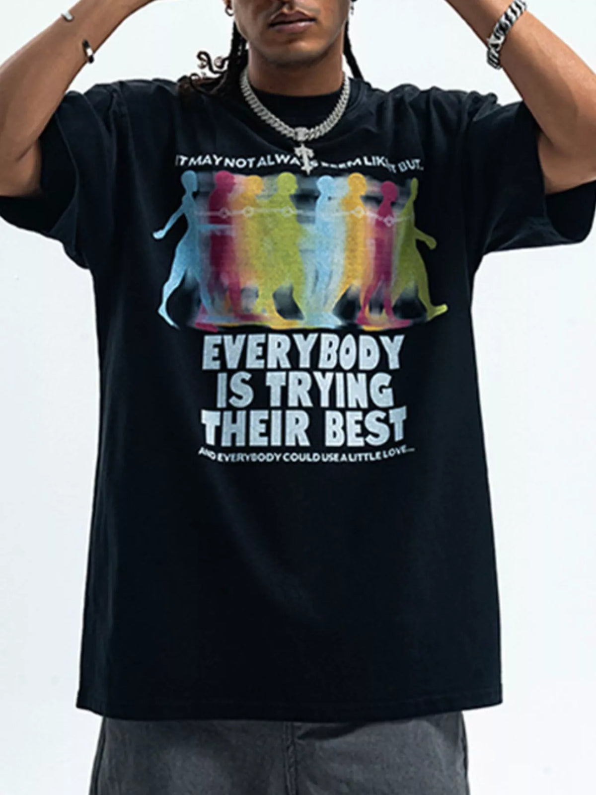 Men's graphic round neck short sleeve T-shirt by Trendsi featuring a colorful design on soft fabric.