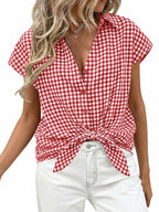 Women's classic gingham print button-down shirt with tie detail, featuring long sleeves and a collared neckline.