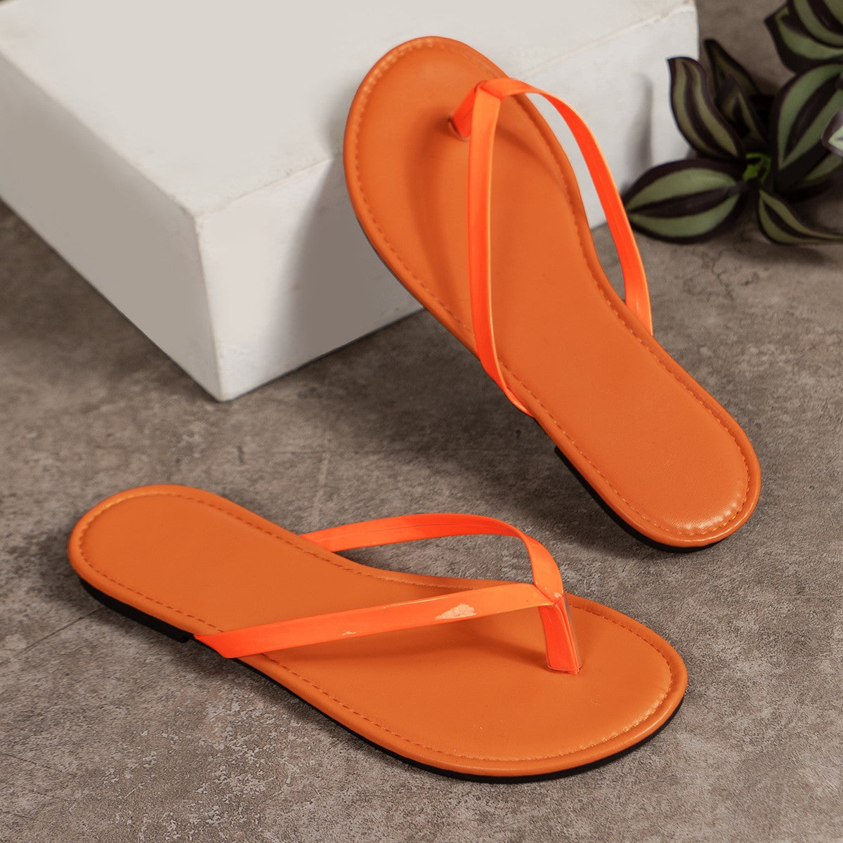 Plush Fashion Hub toe post flats sandals with cushioned straps and flat sole, perfect for casual summer wear.