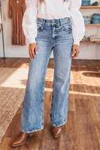 Acid wash flare jeans with pocket details from Shopimist, showing the distressed fabric and stylish fit.