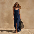 Women's minimalist sleeveless slip dress in a relaxed fit, casual resort style by Plush Fashion Hub, shown in a light fabric.