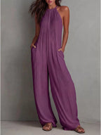 Sleeveless wide-leg jumpsuit by Shopimist featuring a relaxed fit and stylish design, shown in a neutral fabric with flowing silhouette.
