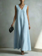Plus size V-neck sleeveless maxi dress by Trendsi, full-length dress with a flowing fabric and elegant design.