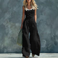 Women's vintage high-waist wide-leg jumpsuit by Plush Fashion Hub featuring button closure and elegant retro style.