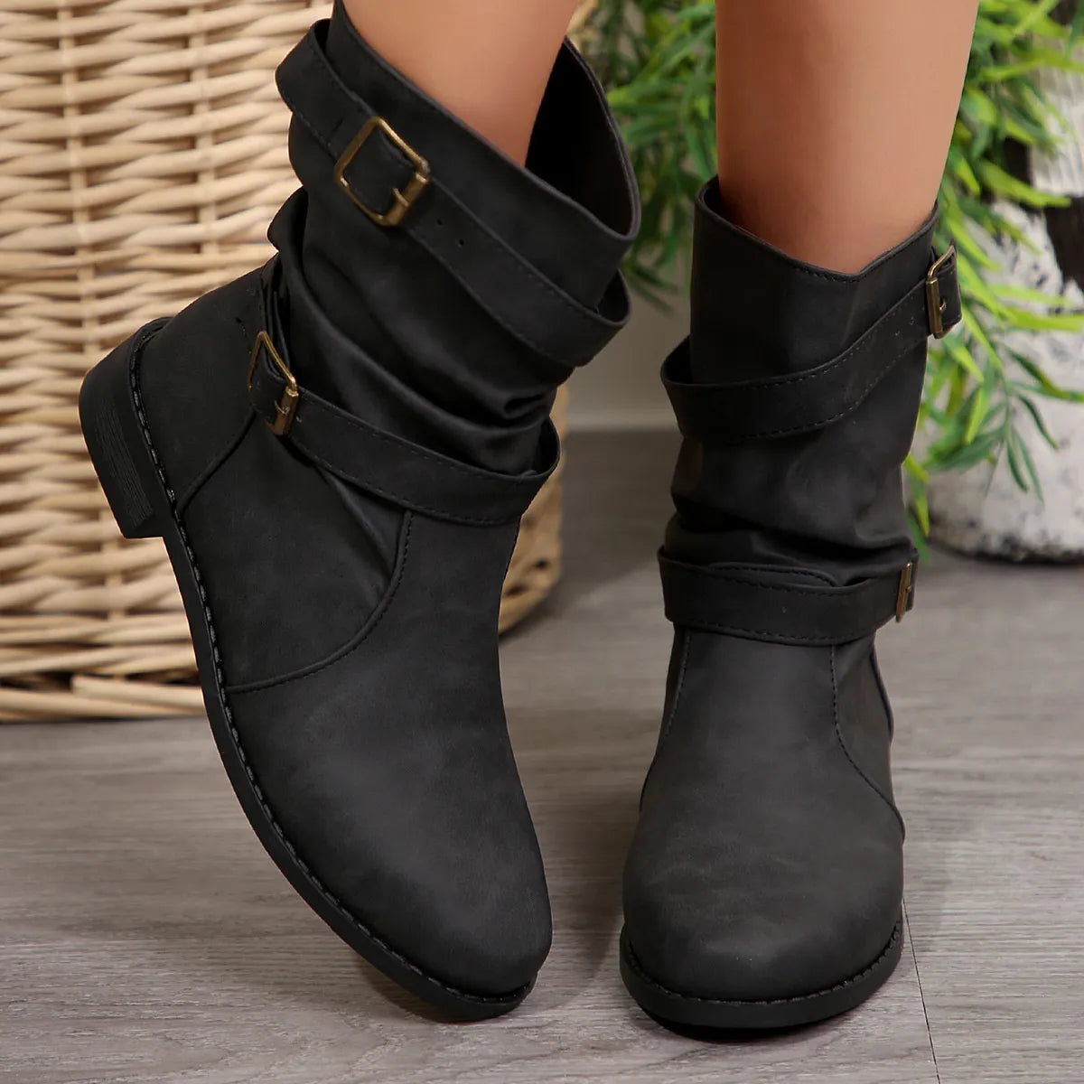 Mid-calf buckle strap boots from Trendsi featuring a stylish design with buckles and a sturdy sole, perfect for fashionable footwear.