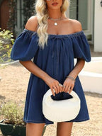 Women's off-shoulder tie-front denim mini dress by Trendsi, casual chic summer dress with a relaxed fit and stylish details.