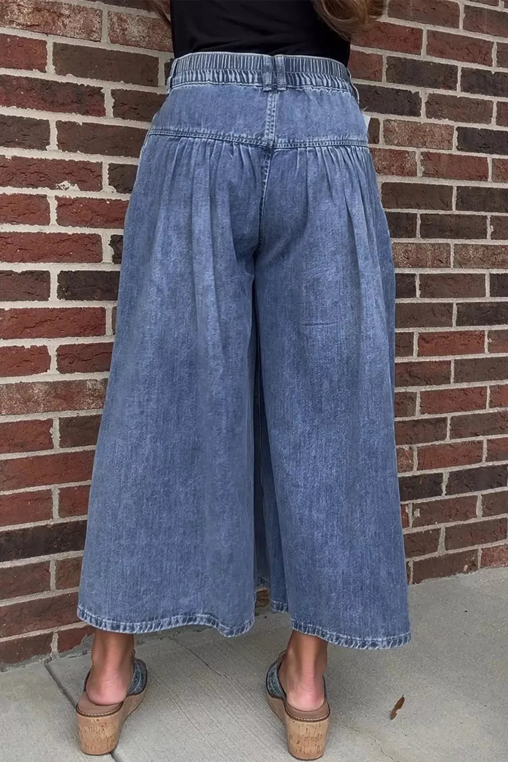 High-waisted wide-leg button-fly jeans in classic cotton denim from Plush Fashion Hub, shown on a model with a relaxed fit.