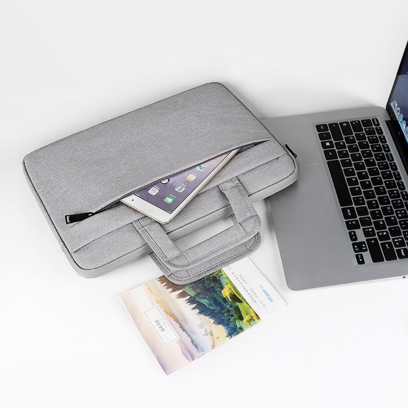 Plush Fashion Hub laptop bag and business briefcase with multiple compartments, black nylon exterior, and padded shoulder strap.