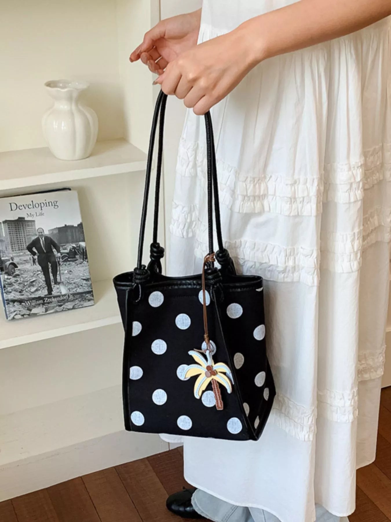 Plush Fashion Hub polka dot shoulder handbag with black and white pattern, leather strap, and compact design for everyday use.