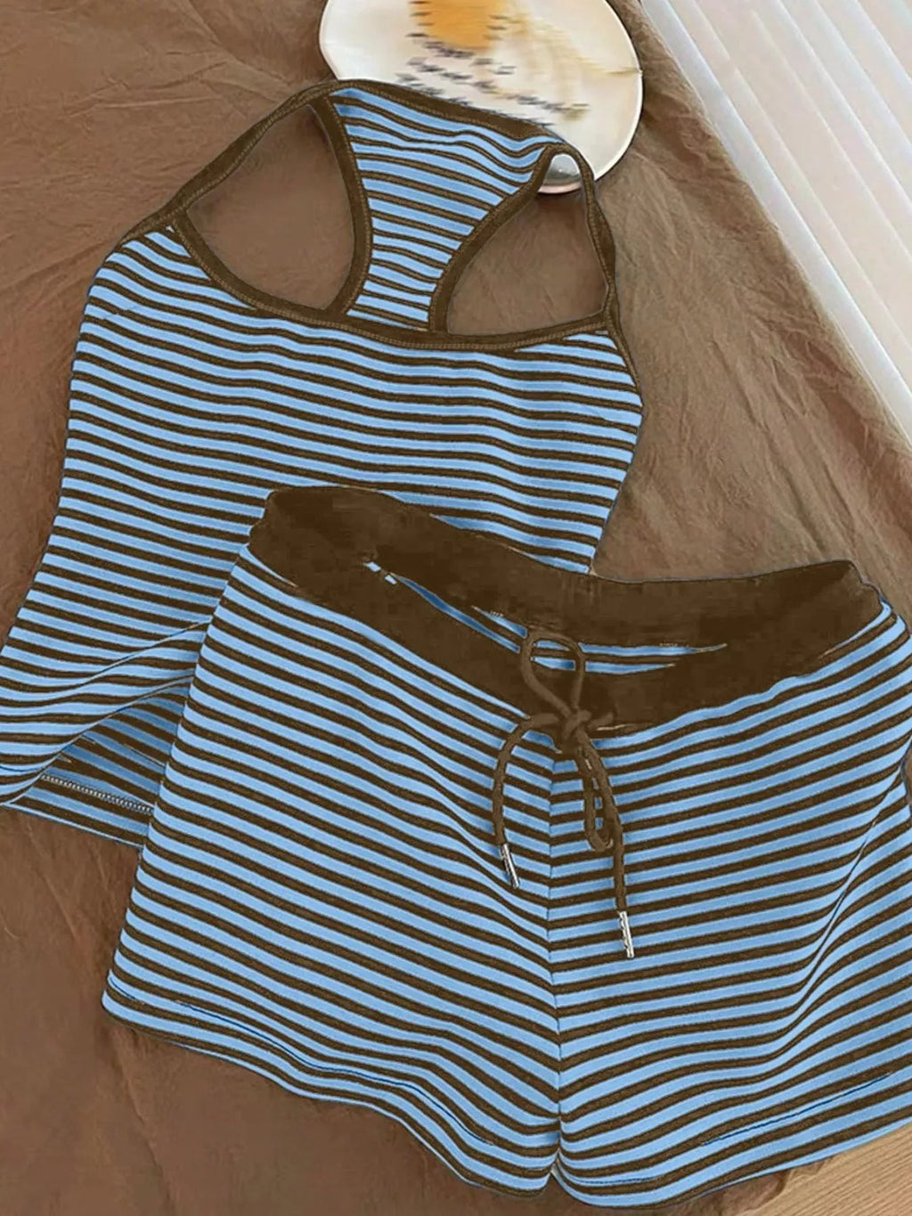 Striped tank top and shorts set from Trendsi featuring a casual summer look, with the focus on the matching striped fabric and relaxed fit.