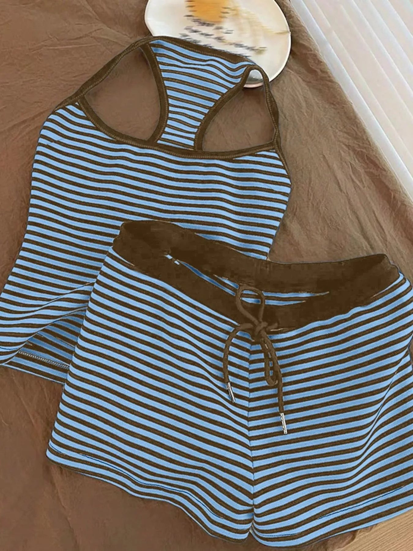 Striped tank top and shorts set from Trendsi featuring a casual summer look, with the focus on the matching striped fabric and relaxed fit.