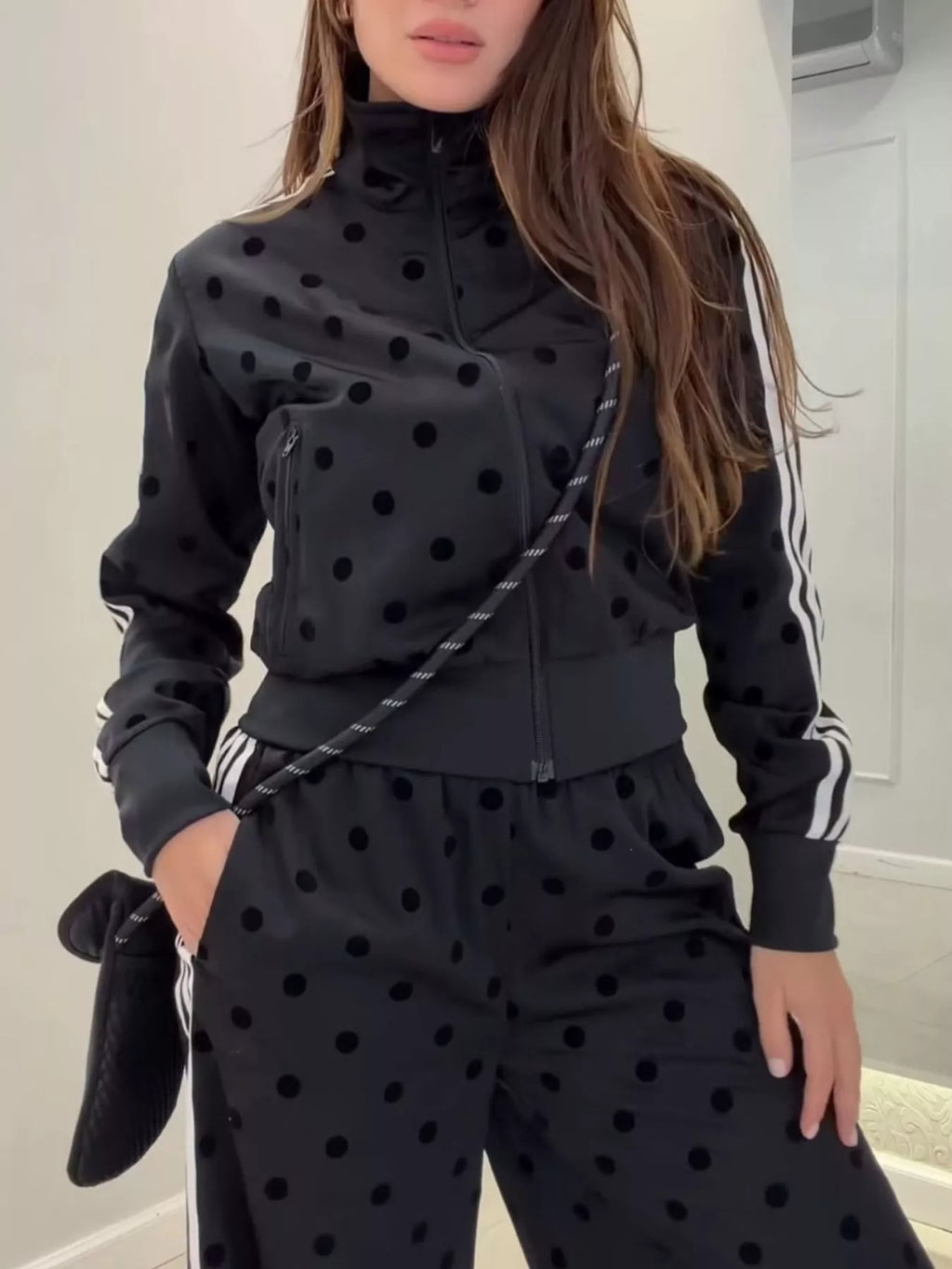 Polka dot zip-up outerwear and pants set by Plush Fashion Hub, featuring a matching stylish and comfortable design.