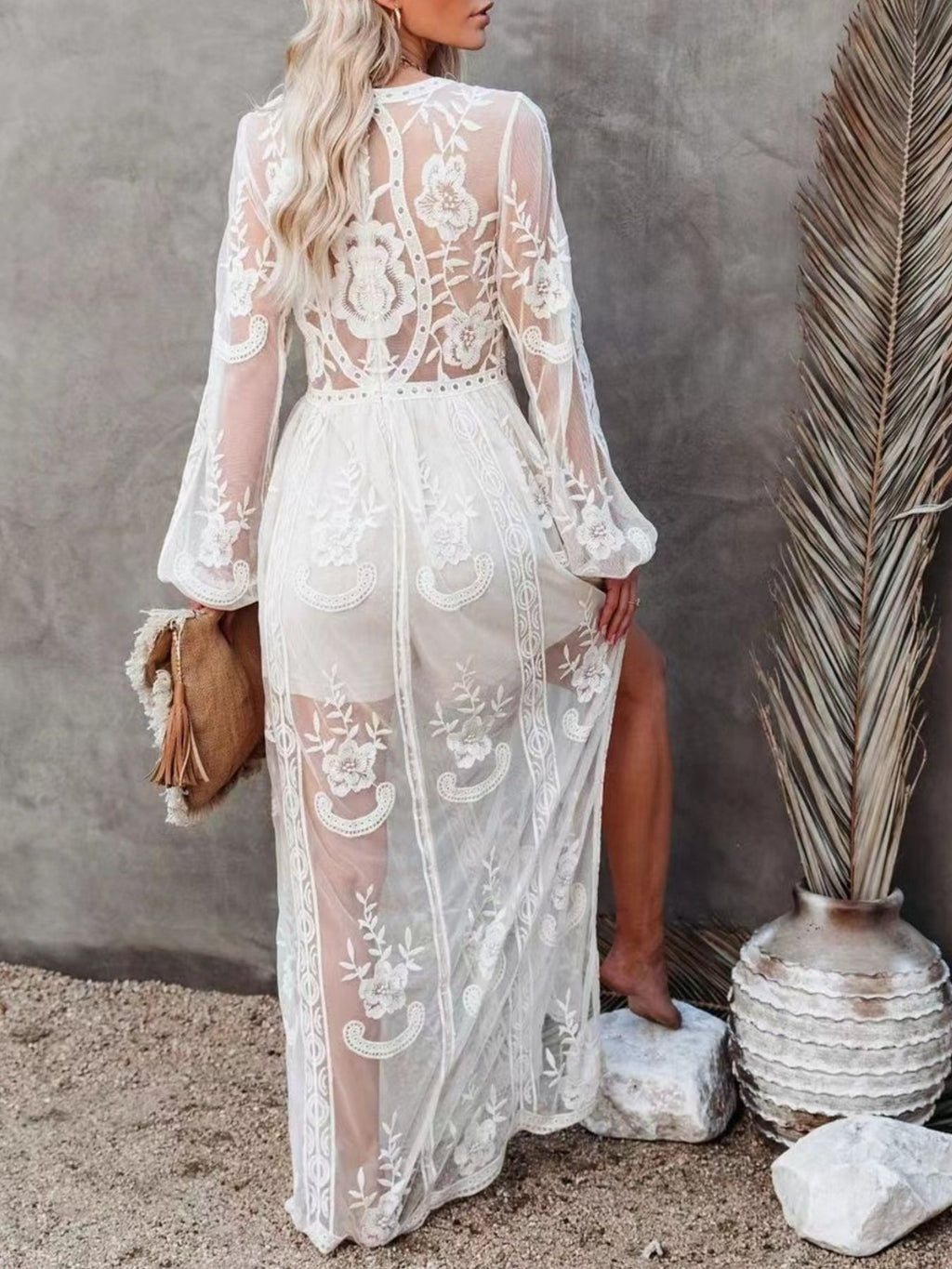 Elegant floral lace high-slit maxi dress by Trendsi, featuring intricate lace details and a flowing evening gown silhouette.