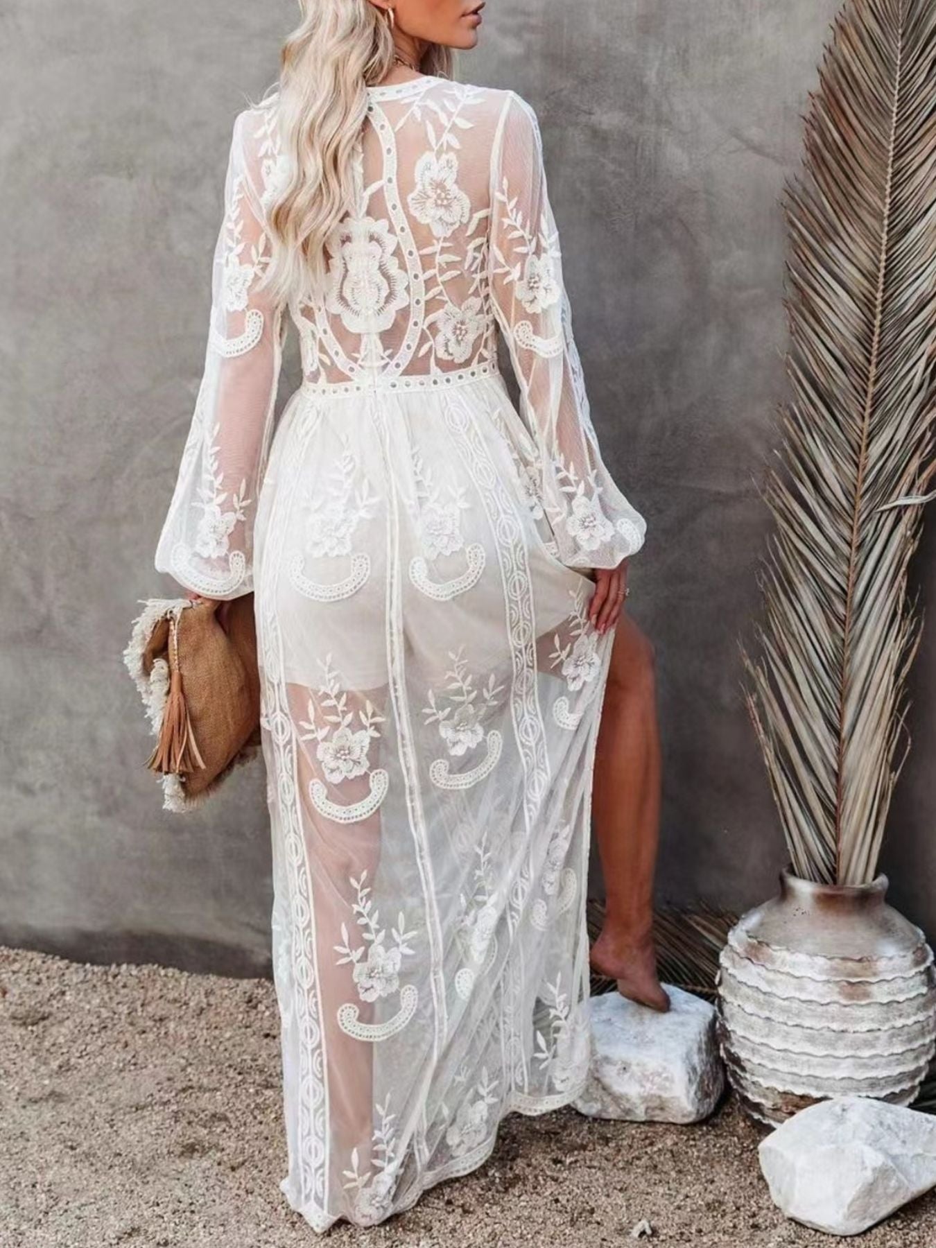 Elegant floral lace high-slit maxi dress by Trendsi, featuring intricate lace details and a flowing evening gown silhouette.