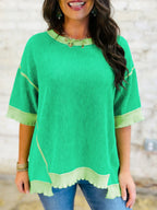 Women's ribbed twist hem short sleeve T-shirt by Trendsi with contrast stitching, shown in a casual front view.
