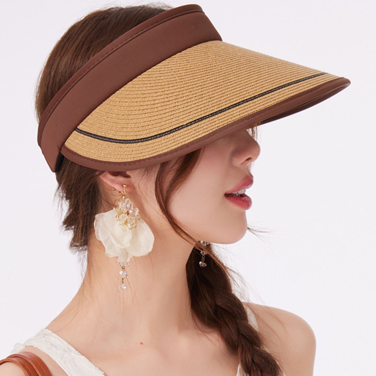 Women's wide brim straw visor hat by Trendsi, breathable UV sun protection accessory with a stylish, wide brim design.