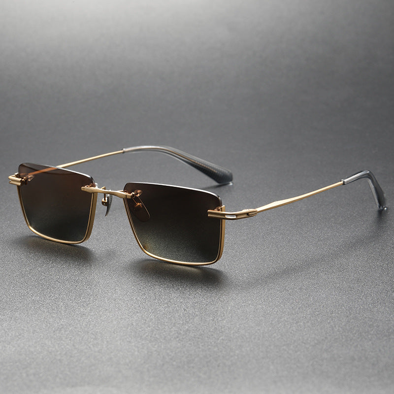 Pure titanium polarized sunglasses with retro British style, featuring sleek frame and tinted lenses, by Plush Fashion Hub.