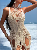 Flowy cutout halter neck cover-up dress by Trendsi featuring a stylish open back and lightweight fabric for beachwear.