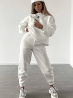 Women's loose fit crewneck sweatshirt and jogger pants two-piece set by Plush Fashion Hub, casual loungewear with comfortable fit.
