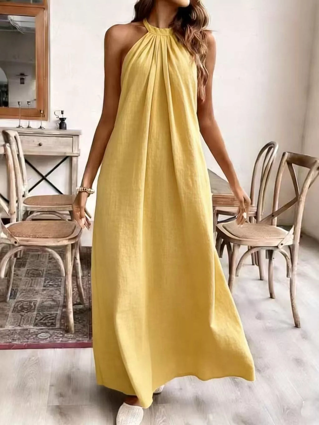 Elegant black halter neck maxi dress from Shopimist with flowing fabric and a stylish design for formal occasions.